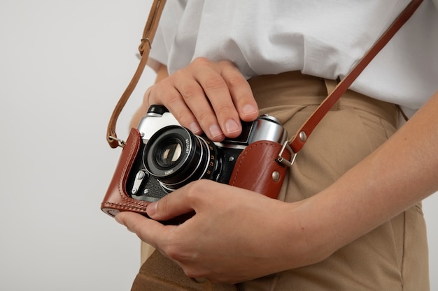 Free photo view of person holding professional digital camera