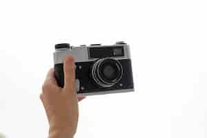 Free photo view of person holding professional digital camera