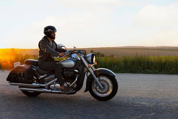 Free photo view of person riding a motorbike outdoors