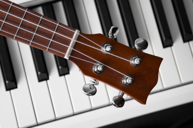 View of piano and guitar in musical instruments store