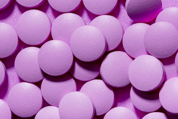 Above view pills on purple background