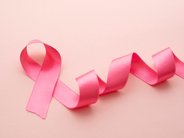 Above view pink ribbon cancer concept