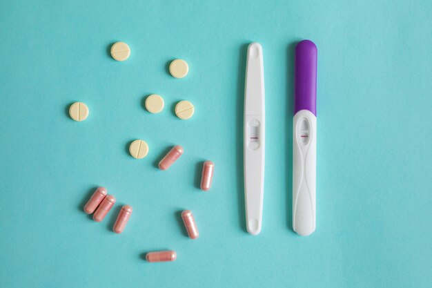 Above view pregnancy tests and medicine