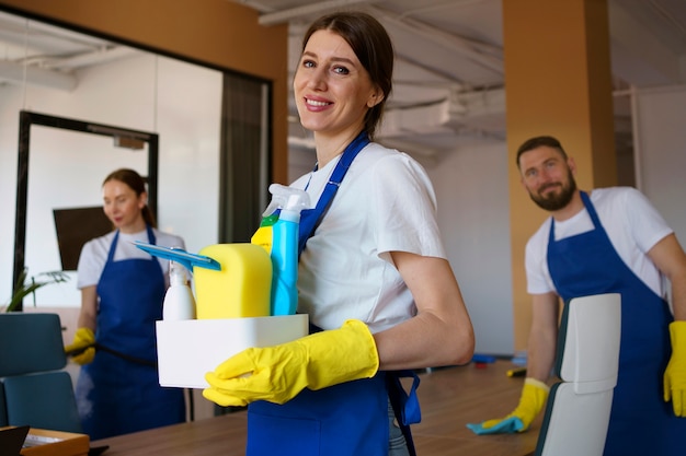 View of professional cleaning service person holding supplies