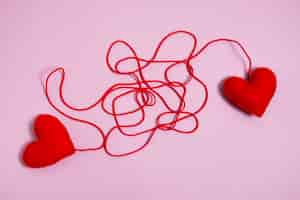 Free photo view of red thread with heart shape