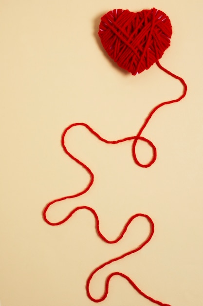 Free photo view of red thread with heart shape