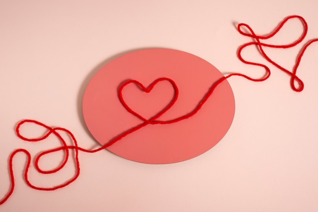 Free photo view of red thread with heart shape