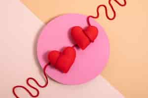 Free photo view of red thread with heart shape