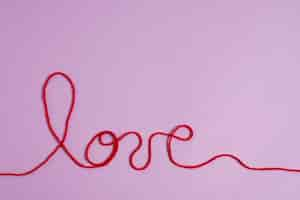 Free photo view of red thread with love word