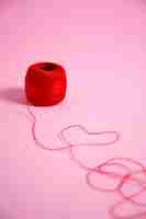 Free photo view of red thread with yarn