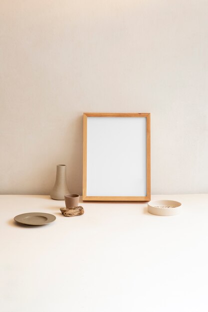 View of room decor made up of frame and plant vase with plate