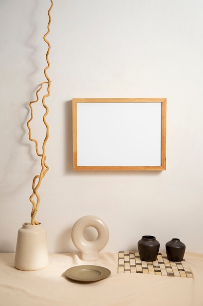 Free photo view of room decor made up of frame and plant vase with plate