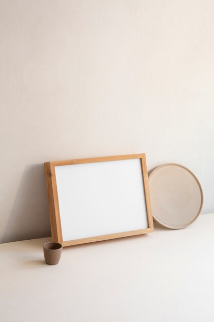 View of room decor made up of frame and plate with cup