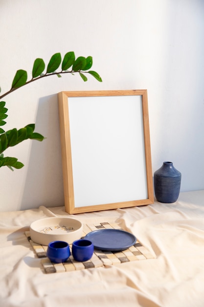 View of room decor made up of frame and plates with cups