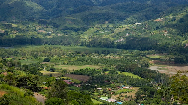 View of rural area with hill and mountain in costa rica