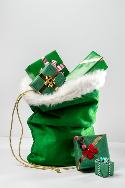 Free photo view of santa claus bag with wrapped gifts