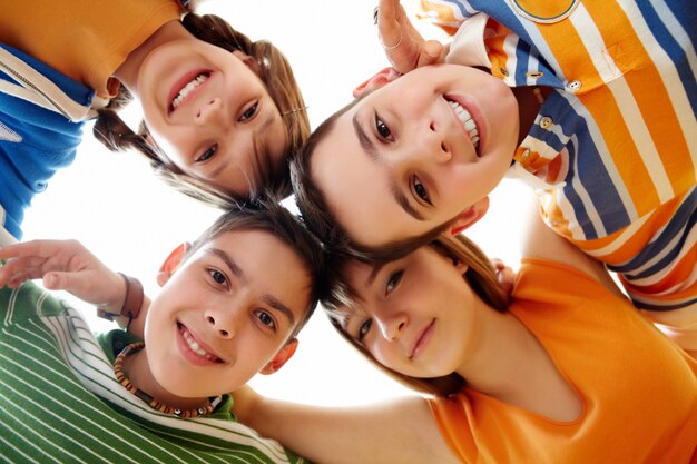 Below view of several students looking at camera