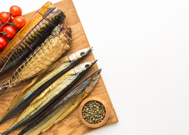 Free photo above view smoked fish on white background