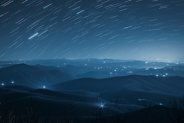 Free photo view of starry night sky with nature and mountains landscape
