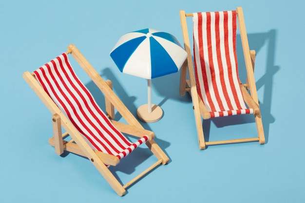 View of summer beach chairs with umbrella