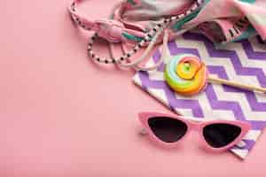 Free photo view of summer sunglasses with bikini