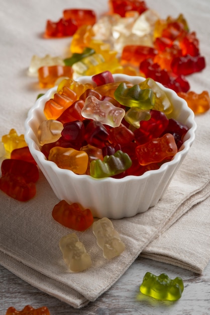 Free photo view of sweet gummy bears with bowl