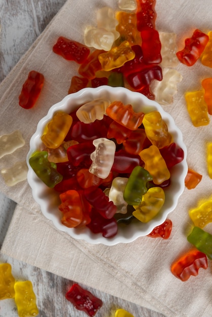 Free photo view of sweet gummy bears with bowl