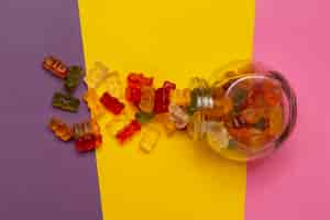 Free photo view of sweet gummy bears with glass jar