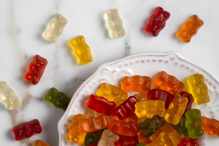 Free Photo view of sweet gummy bears with plate
