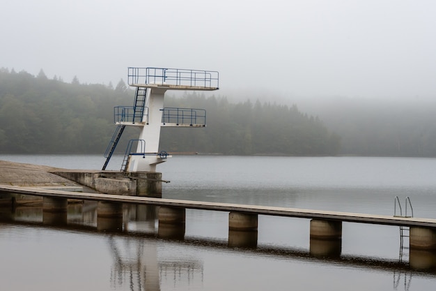 View of a swimming area, a jump tower with ladders