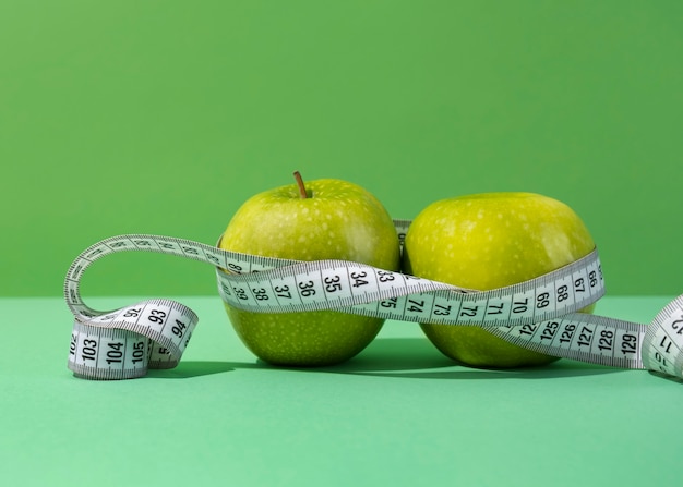 View of tape measure with apple fruit