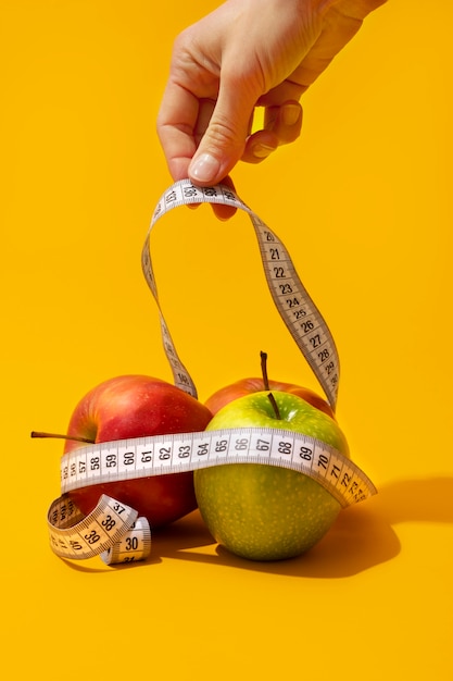 View of tape measure with apple fruits