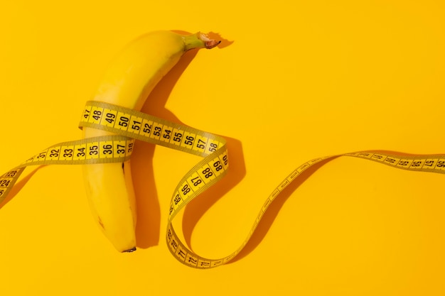 View of tape measure with banana fruit