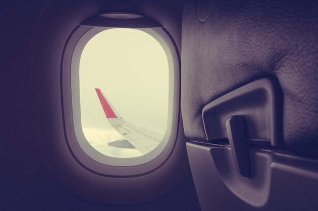 View through plane window .( Filtered image processed vintage ef