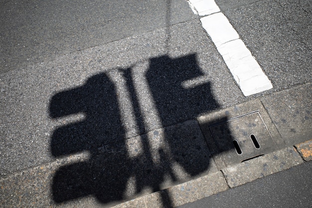 View of traffic lights with daylight shadows