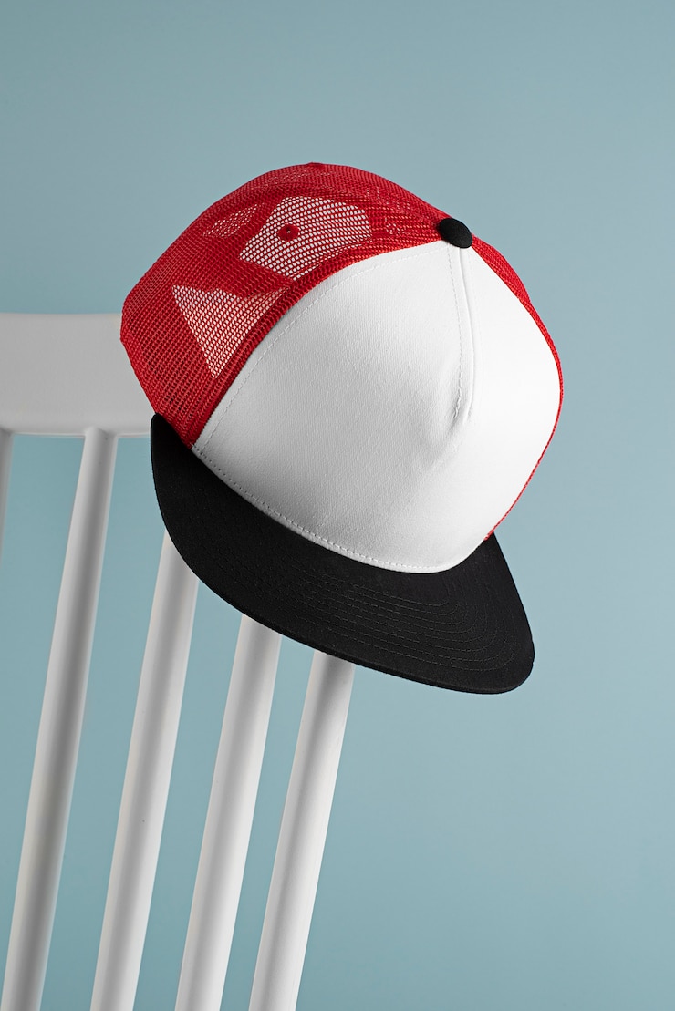 Free Photo view of trucker hat on chair