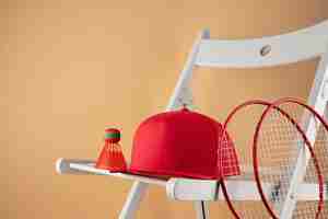 Free photo view of trucker hat with badminton set