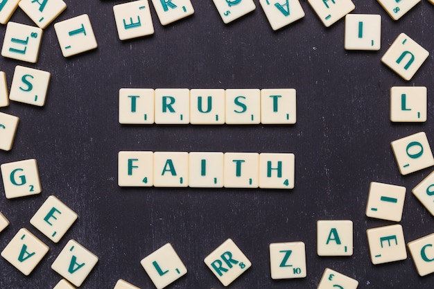 view of trust and faith scrabble letters from above