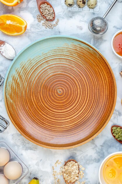 Above view of two-toned plate and ingredients for the healthy food set on ice background