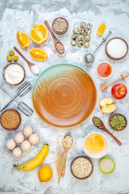 Above view of two-toned plate and ingredients for the healthy foods selection on the right side on ice surface