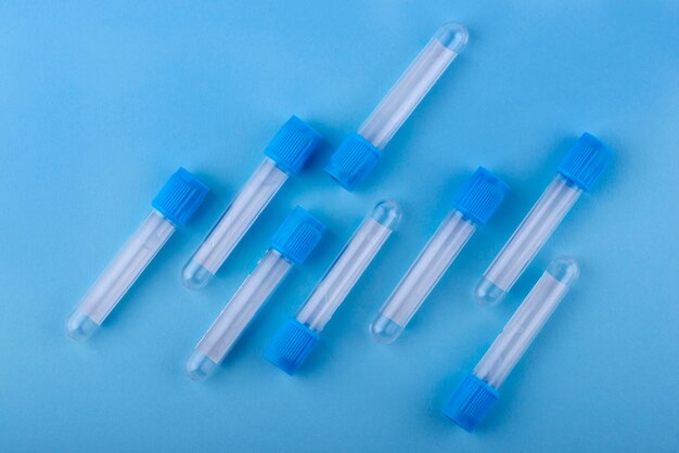 Above view vials on blue background