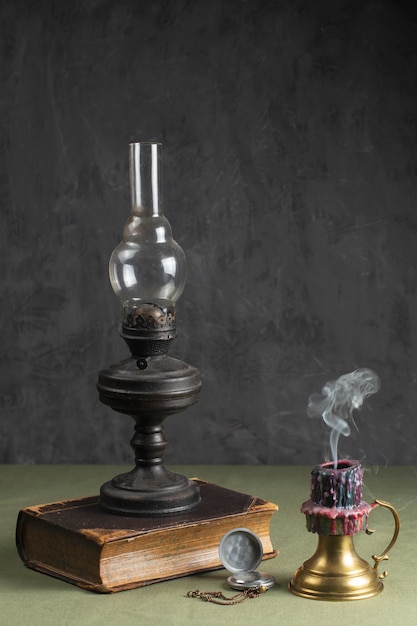 Free photo view of vintage lamp and book
