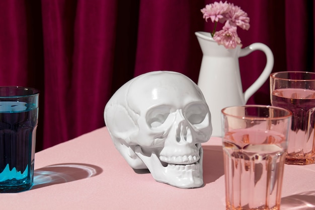 Free photo view of white skull with flower vase