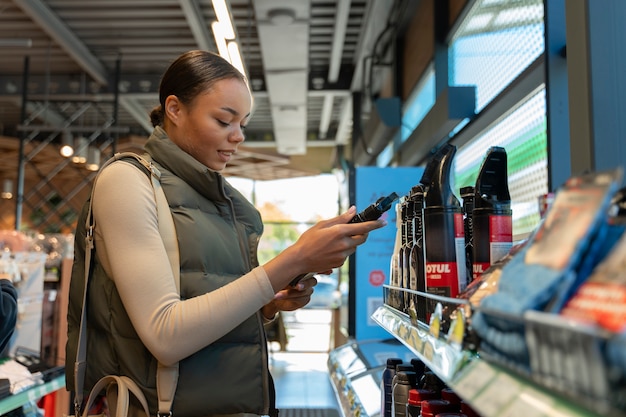 Free photo view of woman at the gas station