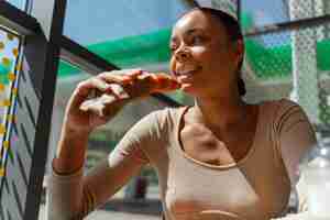 Free photo view of woman at the gas station