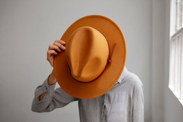 View of woman wearing stylish fedora hat