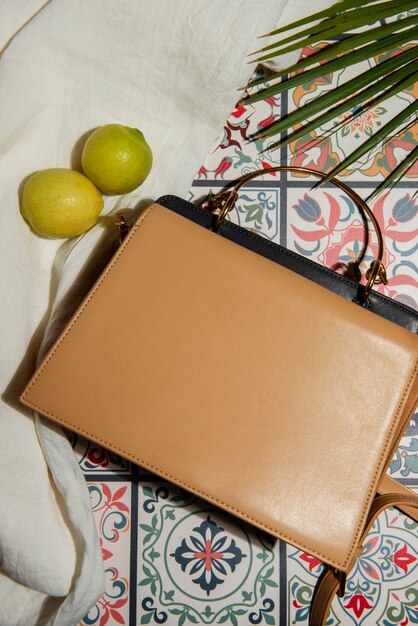 View of women's bag with mediterranean tiles aesthetics