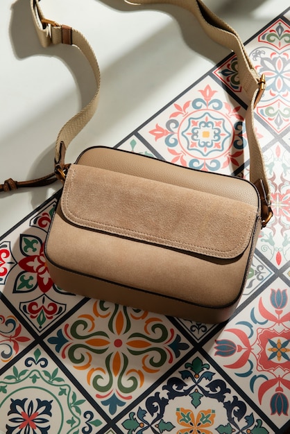 Free photo view of women's purse over tiles with mediterranean aesthetics