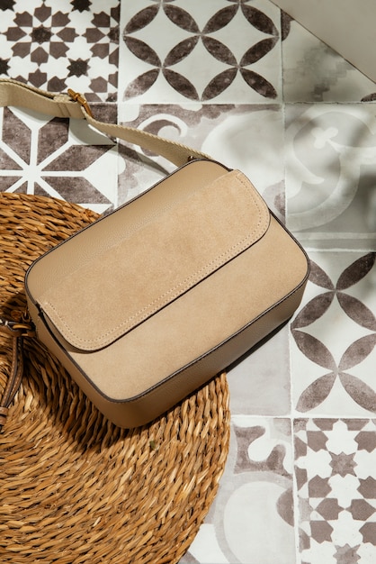 Free photo view of women's purse over tiles with mediterranean aesthetics