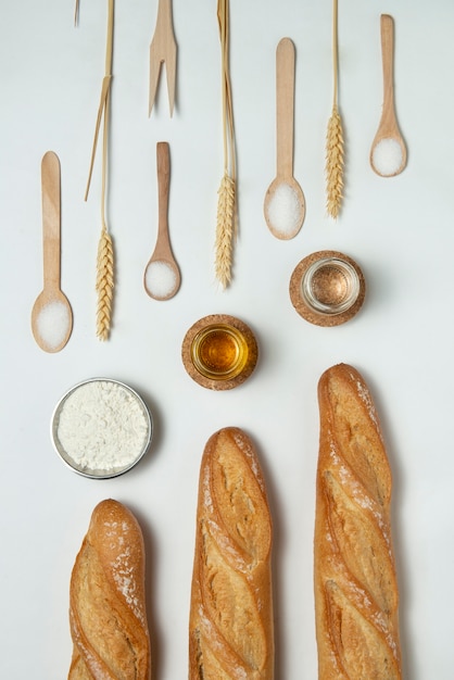 Above view wooden kitchen tools  and bread